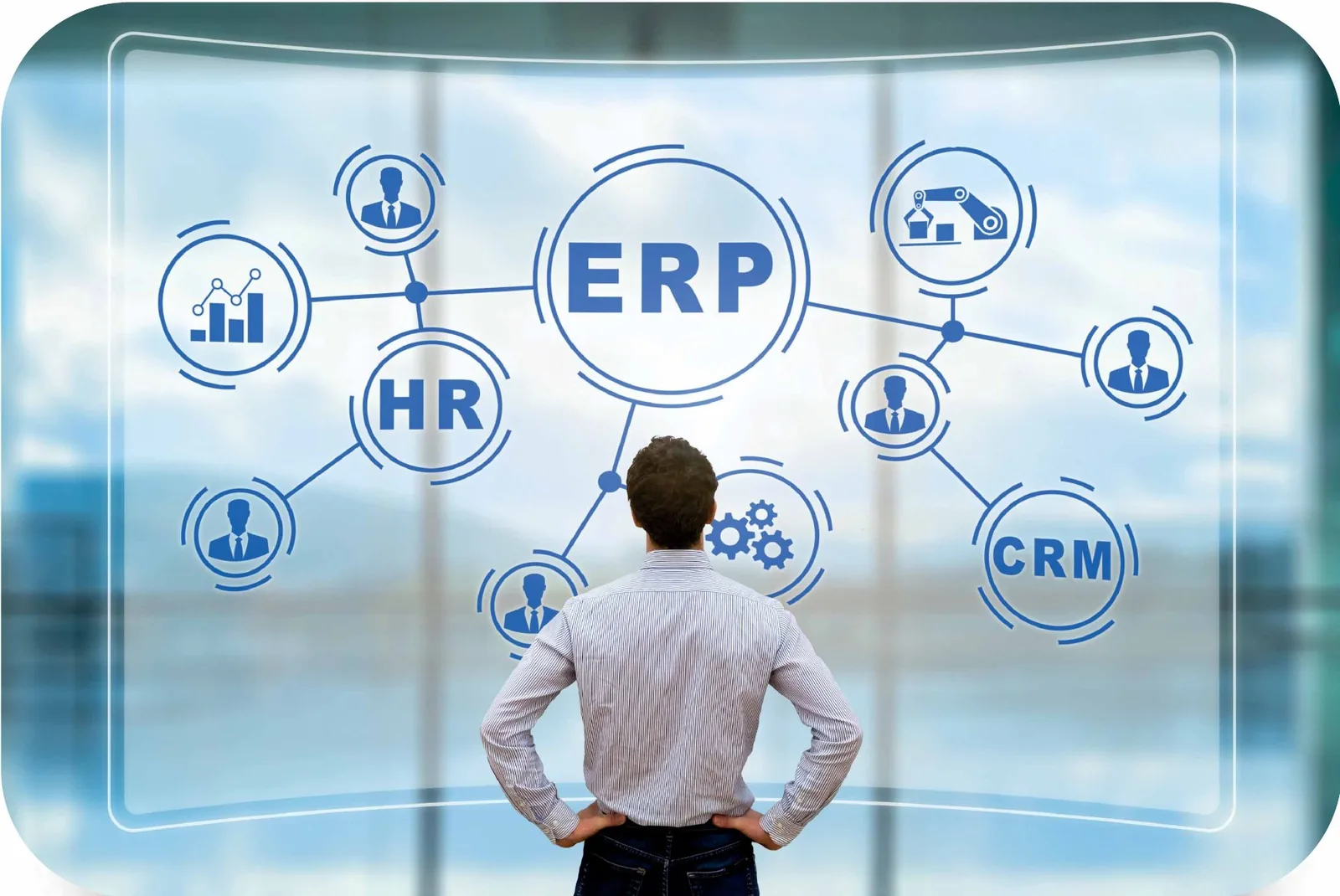 A man facing a projected diagram connecting ERP, HR and CRM modules